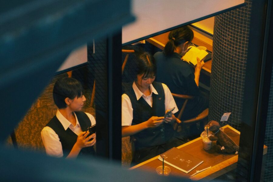 a group of young people sitting next to each other